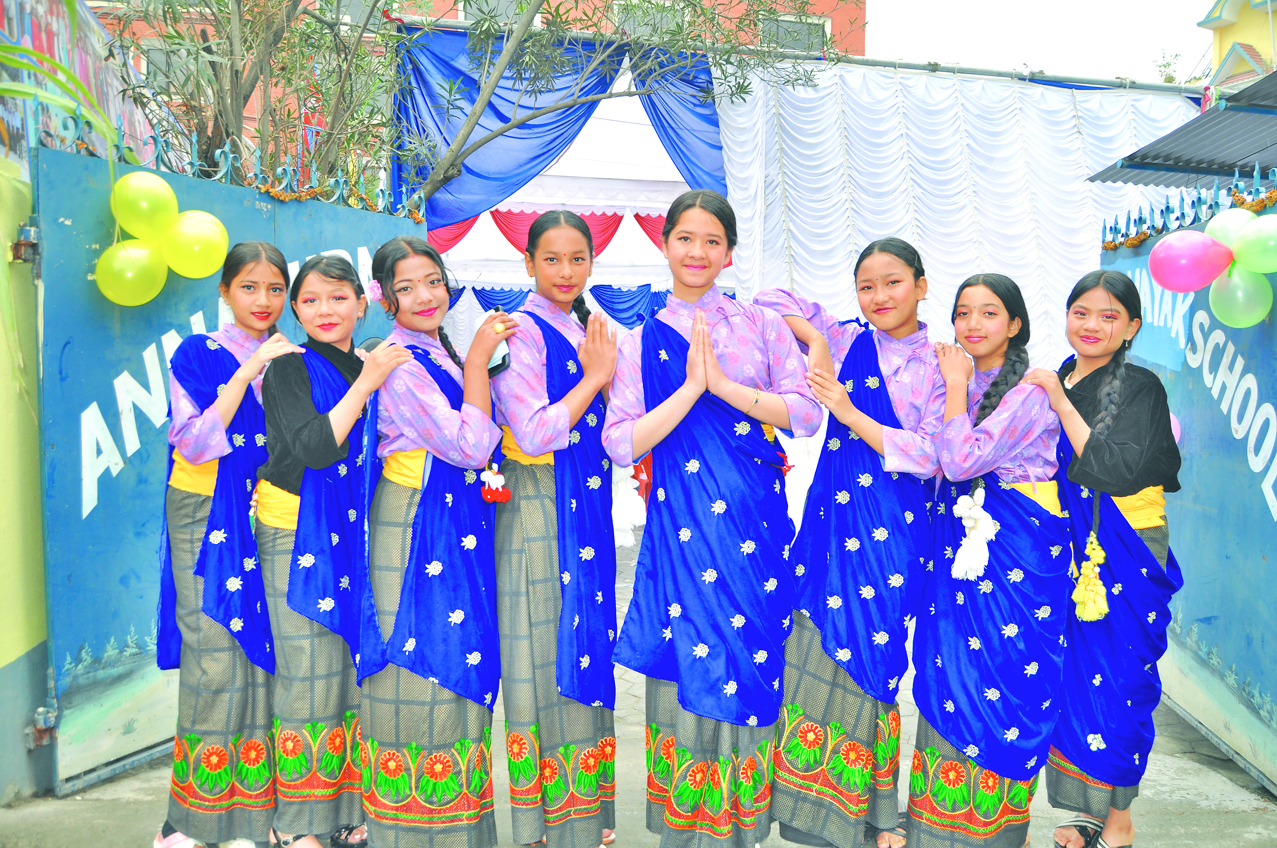 Computer screen showing registration form with flowers on desk